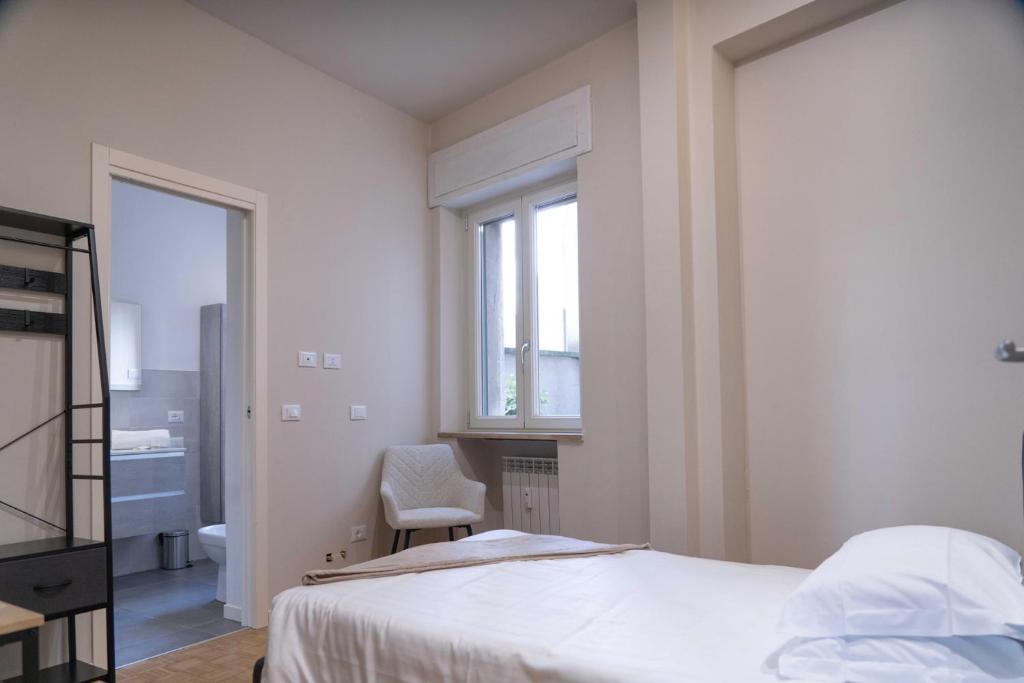 Postel nebo postele na pokoji v ubytování Giardini Rooms