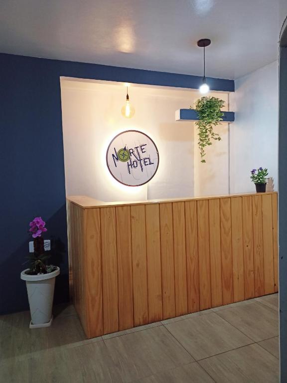 a restaurant with a counter with a sign that says give not at NORTE HOTEL Guaraciaba in Guaraciaba do Norte
