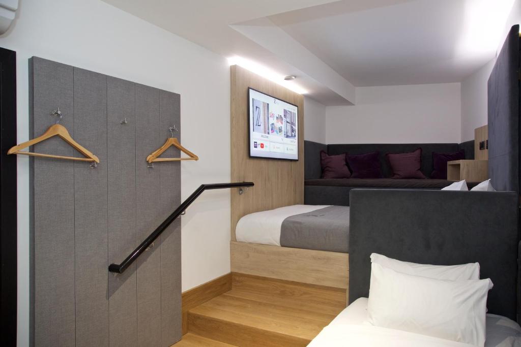 Postel nebo postele na pokoji v ubytování The Z Hotel Leicester Square