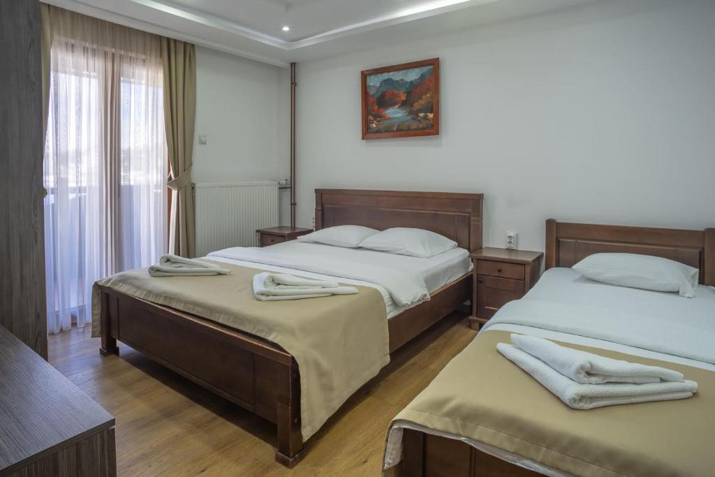 Postel nebo postele na pokoji v ubytování Hotel Pavlović