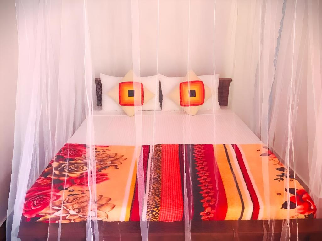 Postel nebo postele na pokoji v ubytování Senehas Homestay