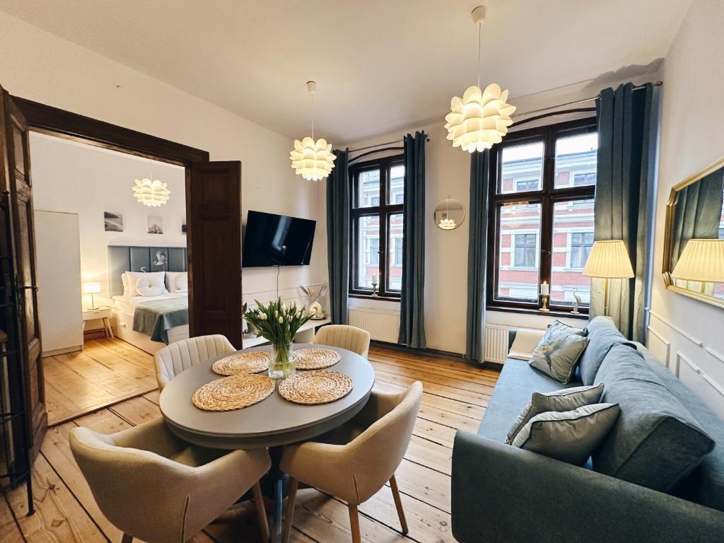 Televízia a/alebo spoločenská miestnosť v ubytovaní Best 2 Rest Apartment