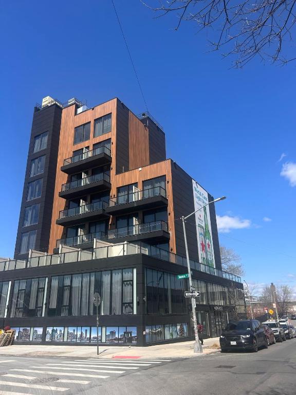 a large building on the corner of a street at Nova Hotel Brooklyn in Brooklyn