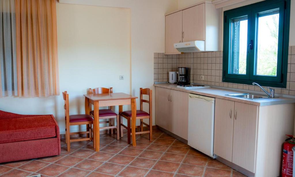 Kuchyň nebo kuchyňský kout v ubytování Coralli Hotel