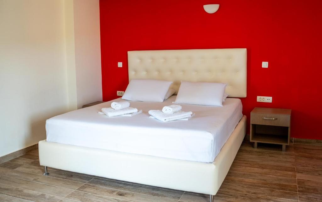Postel nebo postele na pokoji v ubytování Coralli Hotel