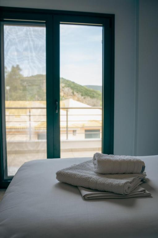 Postel nebo postele na pokoji v ubytování Coralli Hotel