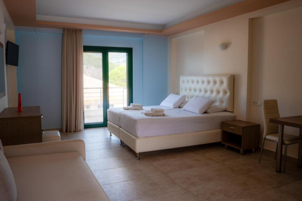 Postel nebo postele na pokoji v ubytování Coralli Hotel