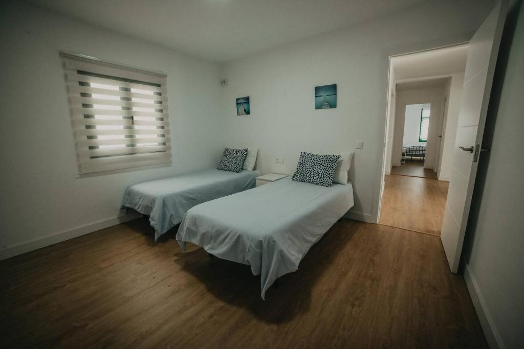 Posteľ alebo postele v izbe v ubytovaní Amplio y cómodo apartamento en La Santa