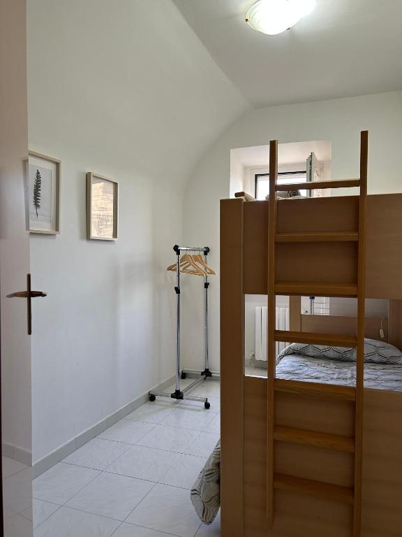 A bed or beds in a room at La Minicasa