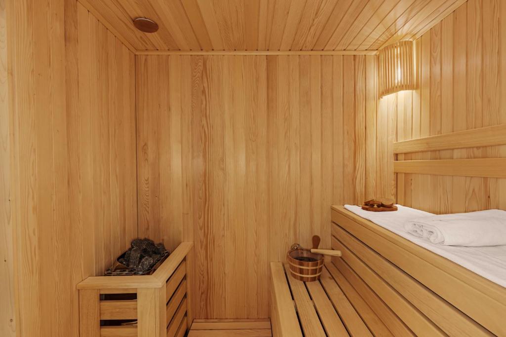 Postel nebo postele na pokoji v ubytování Wulfenia Hotel & Spa