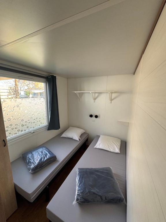 Postel nebo postele na pokoji v ubytování Le Mobil Home chez Cathy - 6pers