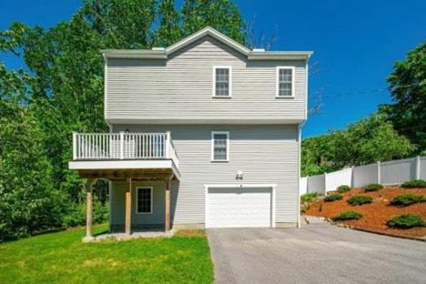 a large house with a white garage at Elegant 3BR Home in Worcester in Worcester