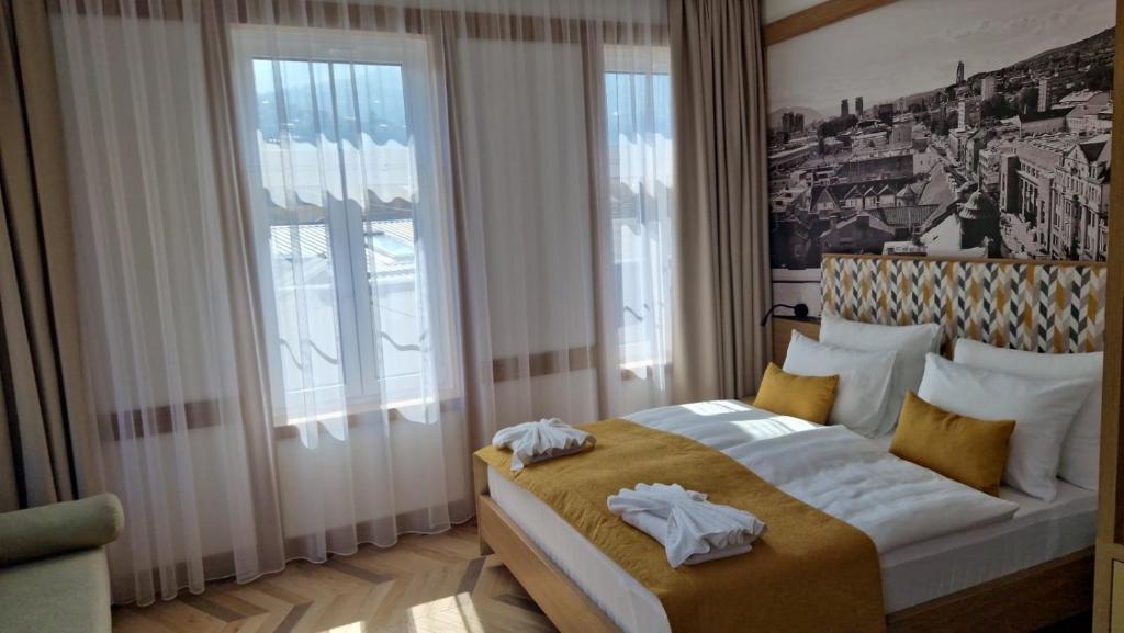 Postel nebo postele na pokoji v ubytování Baš Čaršija Boutique Place