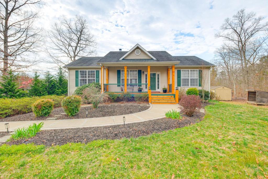 a small yellow house with a porch at Private Deck and Views Rural Virginia Escape in Gordonsville