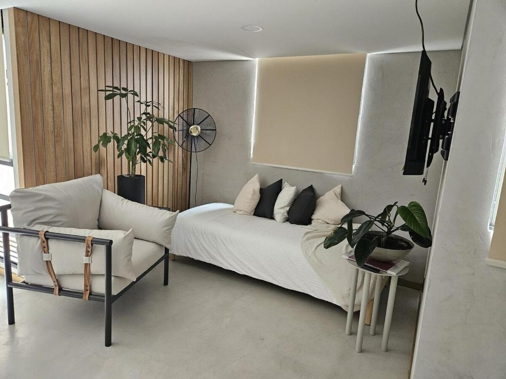 En eller flere senge i et værelse på 2402 Luxury apartment in Sabaneta