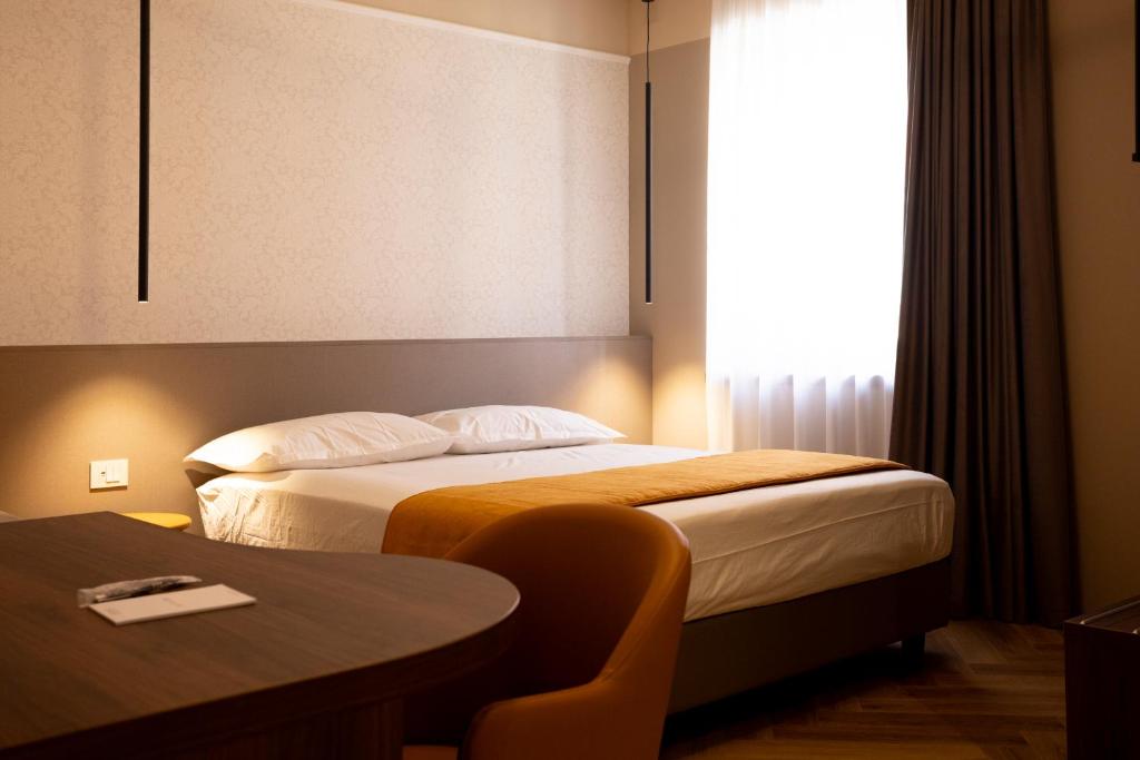 Postel nebo postele na pokoji v ubytování Arianna Suites Longevity