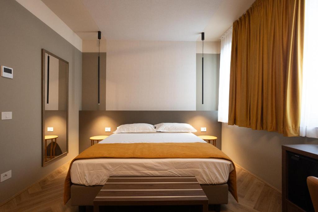 Postel nebo postele na pokoji v ubytování Arianna Suites Longevity
