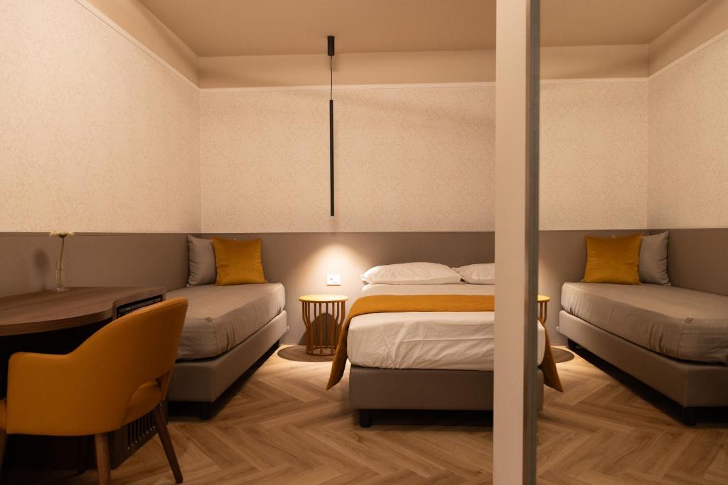 Postel nebo postele na pokoji v ubytování Arianna Suites Longevity