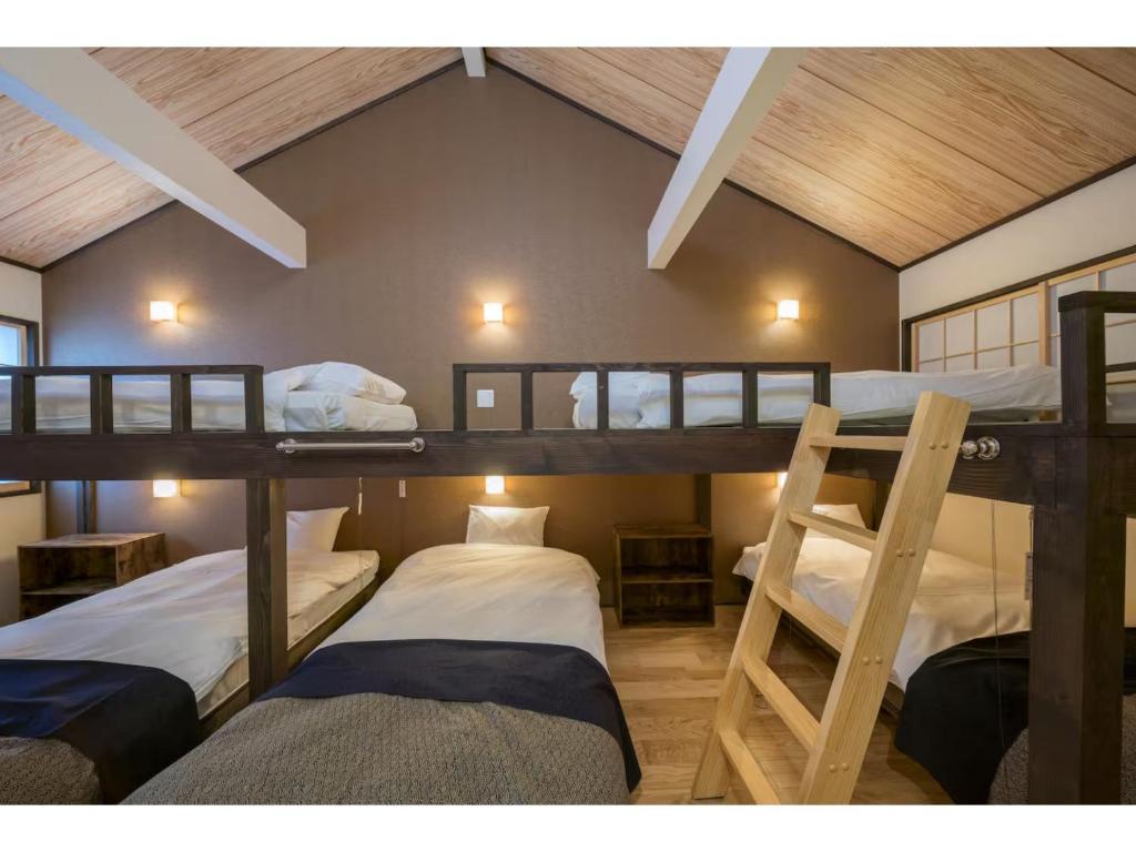 En eller flere senge i et værelse på YADOYA Matsugaya - Vacation STAY 91980v