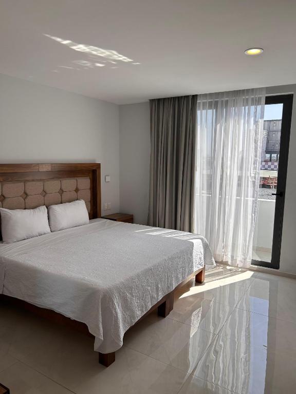 Postel nebo postele na pokoji v ubytování Hotel Concordia