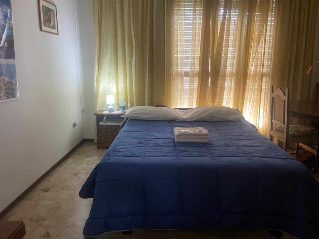 Postel nebo postele na pokoji v ubytování FAMAGOSTA Home