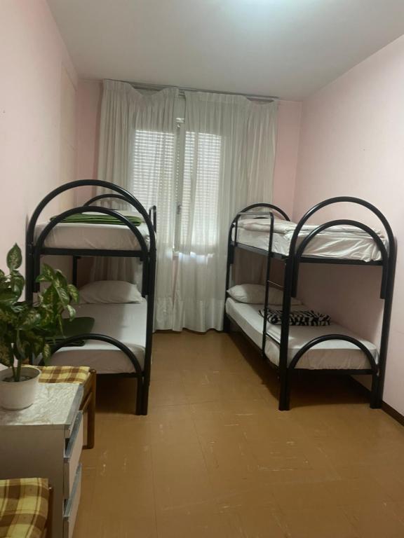 Postel nebo postele na pokoji v ubytování FAMAGOSTA Home