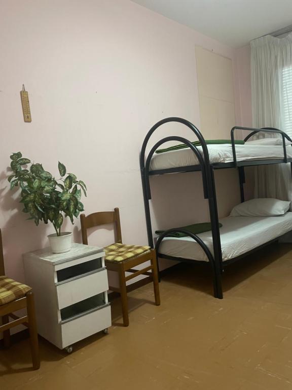 Postel nebo postele na pokoji v ubytování FAMAGOSTA Home
