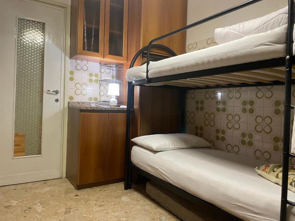 Postel nebo postele na pokoji v ubytování FAMAGOSTA Home
