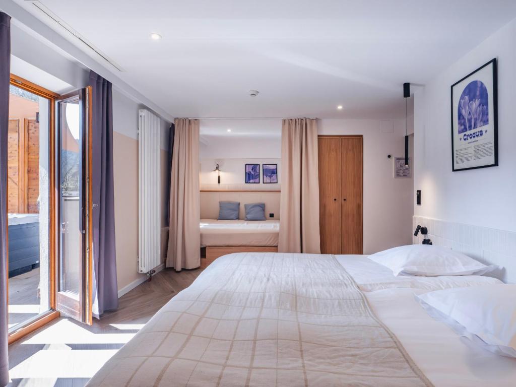 Postel nebo postele na pokoji v ubytování Hotel Au Vieux Moulin