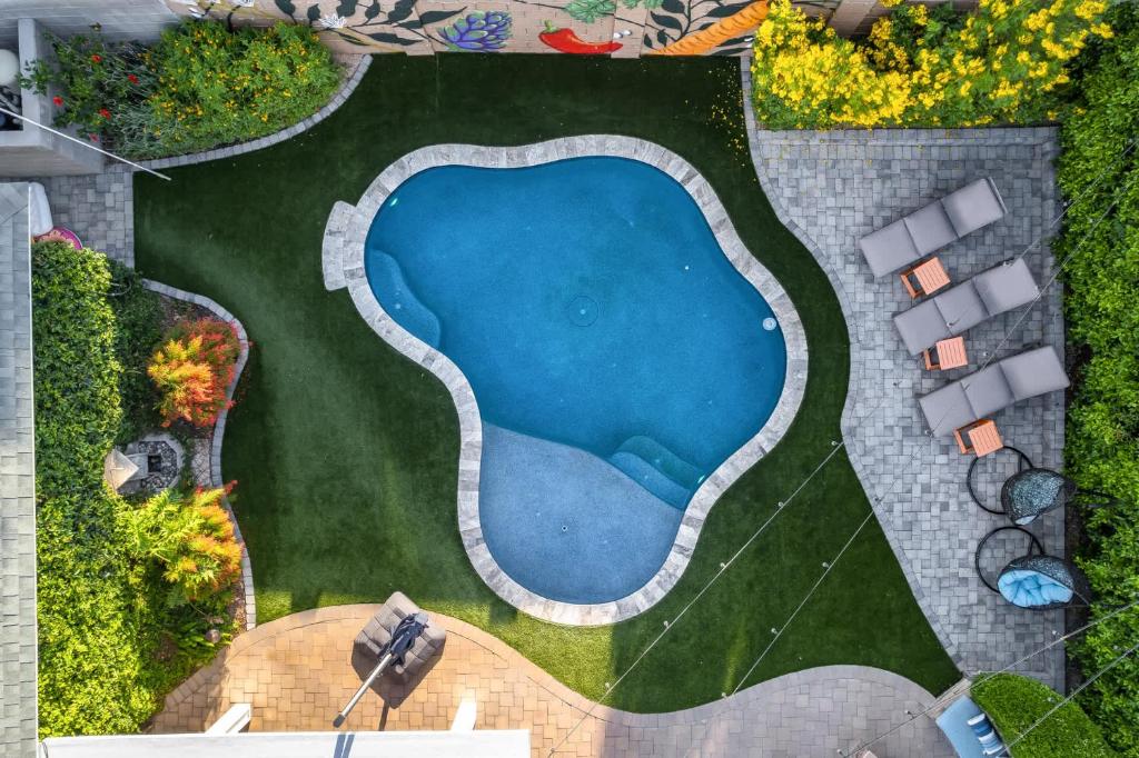 an overhead view of a swimming pool in a garden at Old Town Farm-to-Table Home - Gourmet Adventure with Pool in Scottsdale