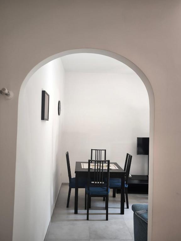 a dining room with a table and chairs at Modern and quiet apartment in Rome