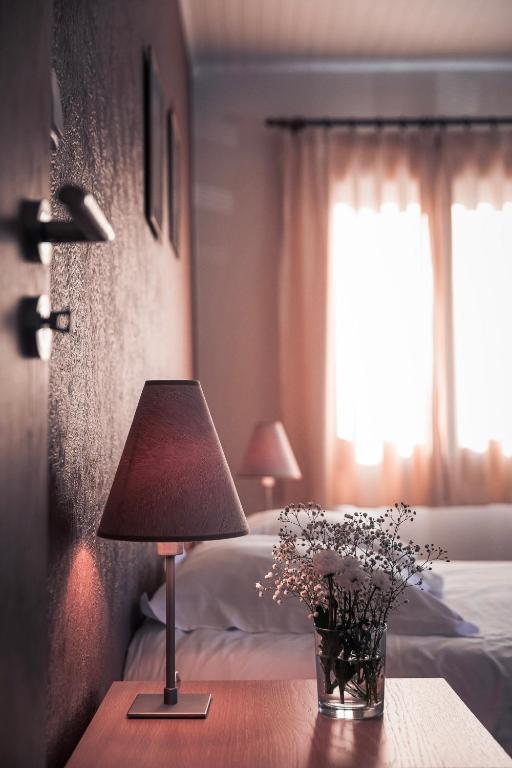 Postel nebo postele na pokoji v ubytování Hotel Au Vieux Moulin