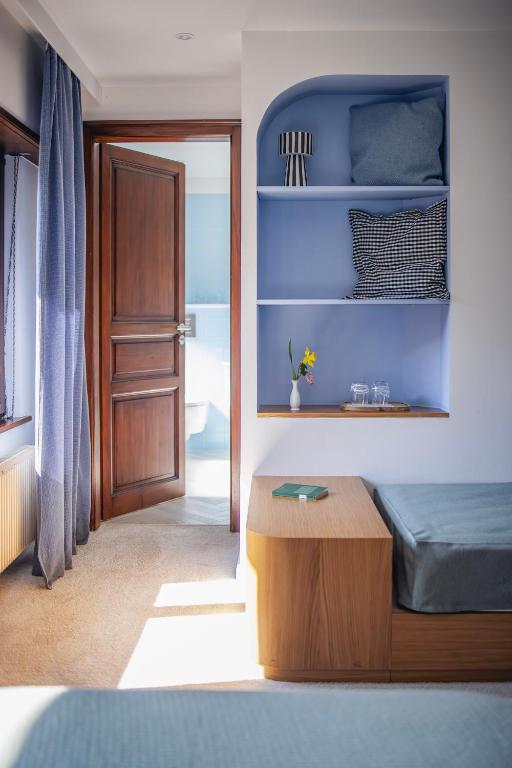 Postel nebo postele na pokoji v ubytování Hotel Au Vieux Moulin
