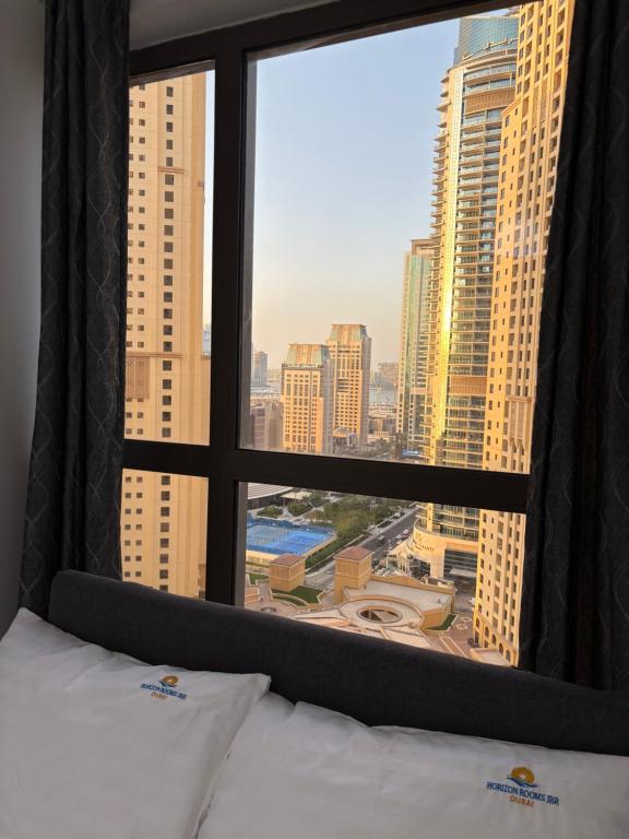 Letto o letti in una camera di Horizon Rooms JBR