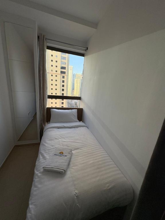 Letto o letti in una camera di Horizon Rooms JBR