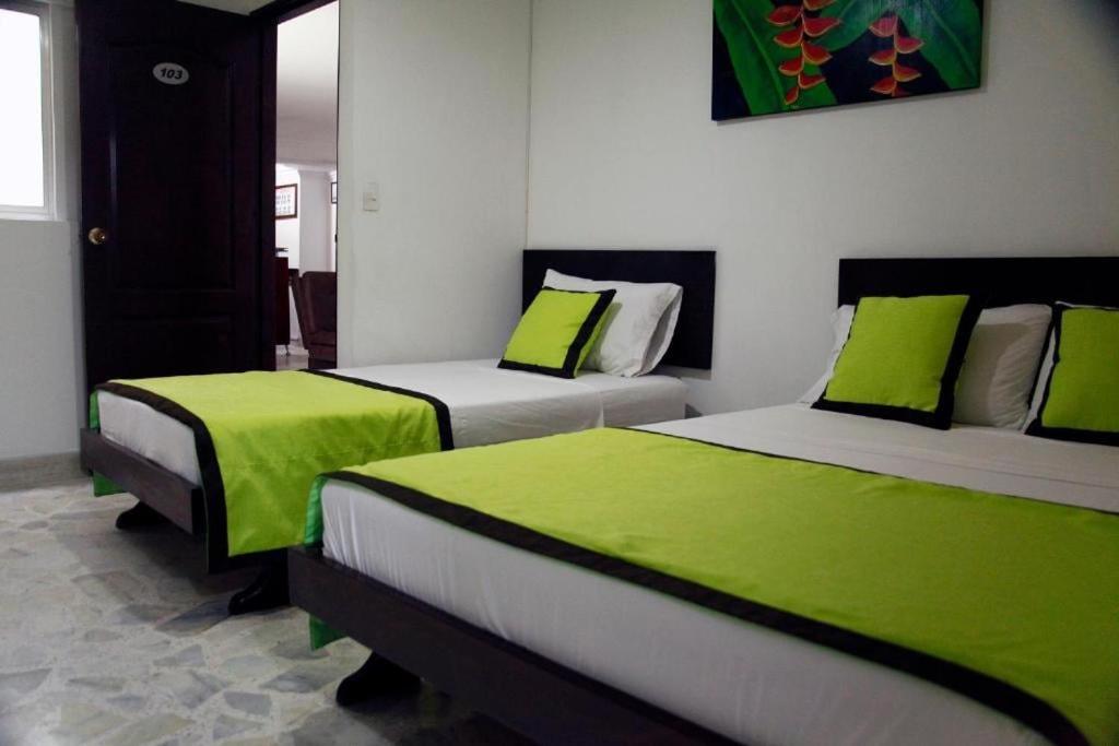 Postel nebo postele na pokoji v ubytování Hotel Astorias