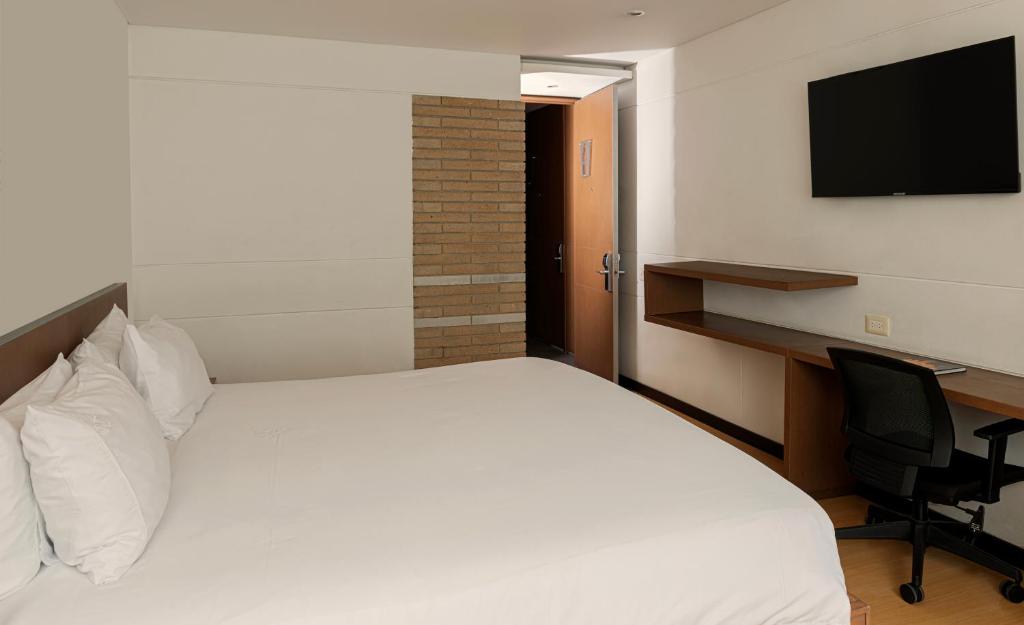 Postel nebo postele na pokoji v ubytování Hotel Viaggio Nueve Tres