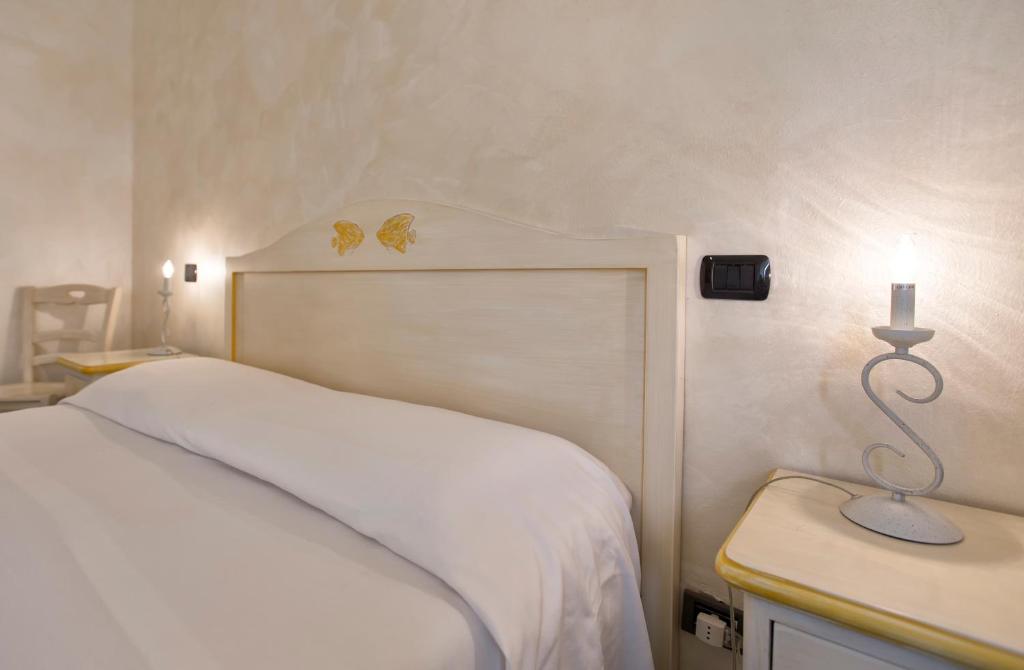 Postel nebo postele na pokoji v ubytování Morpheo Rooms