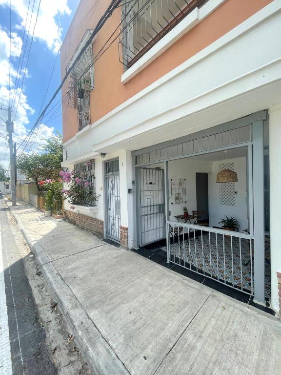 a building with an open door on a street at Akaiah in Santo Domingo