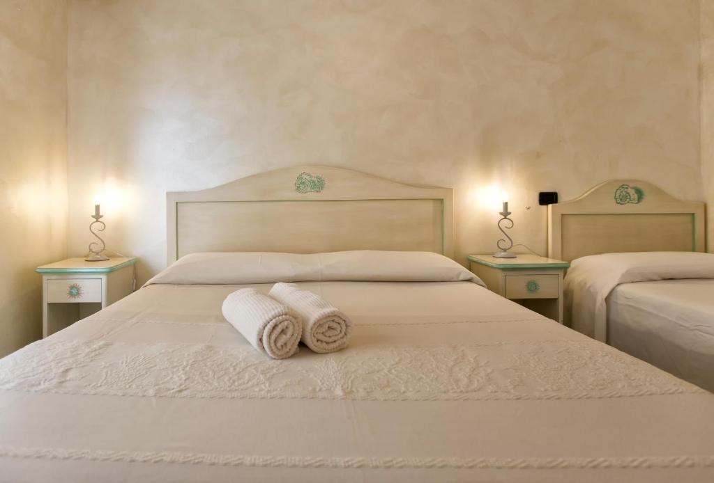 Postel nebo postele na pokoji v ubytování Morpheo Rooms