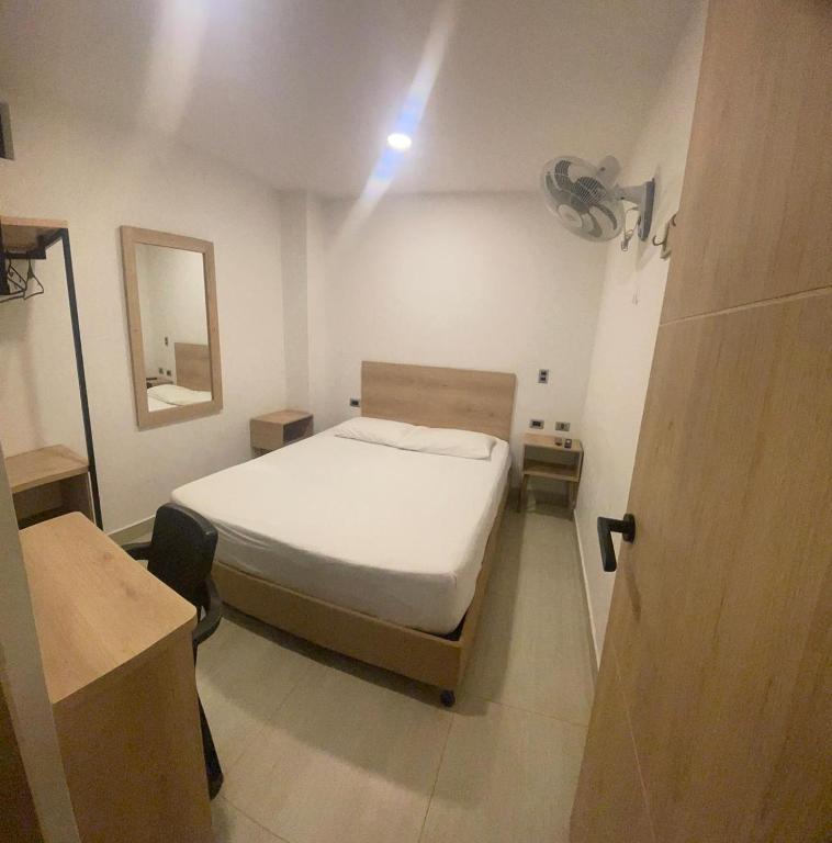 Postel nebo postele na pokoji v ubytování Hotel Villa Real