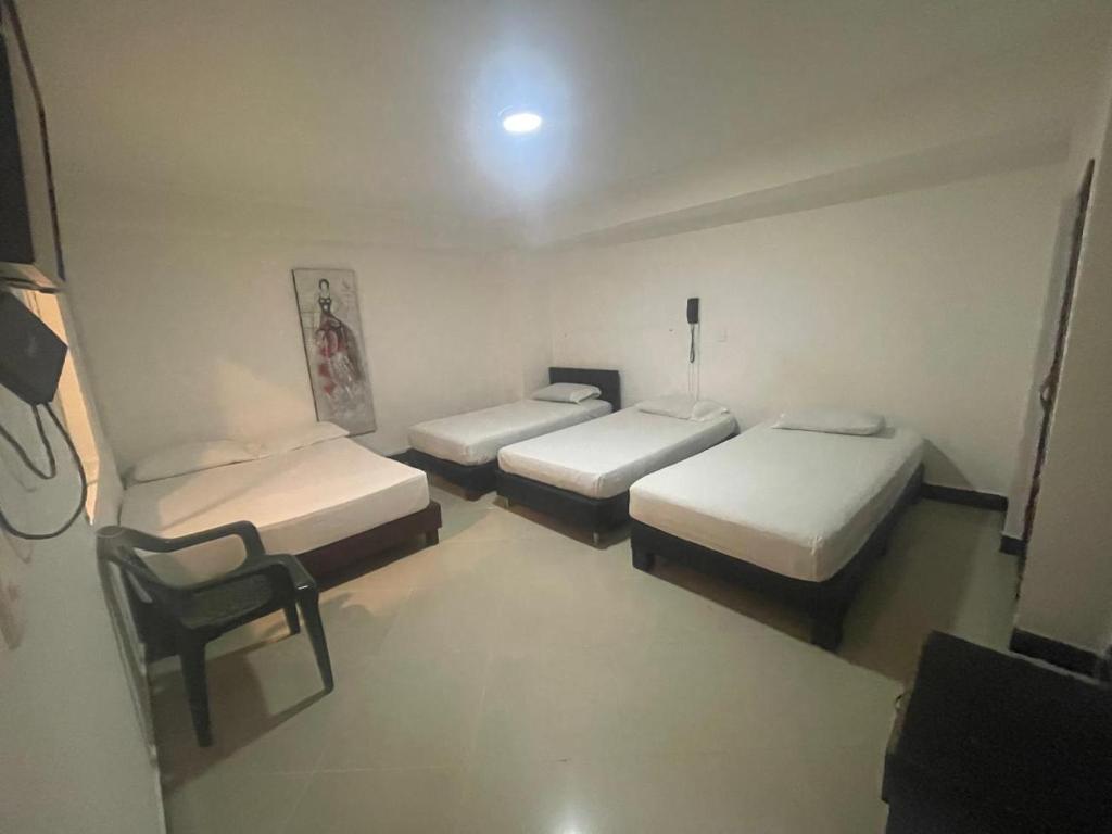 Postel nebo postele na pokoji v ubytování Hotel Villa Real