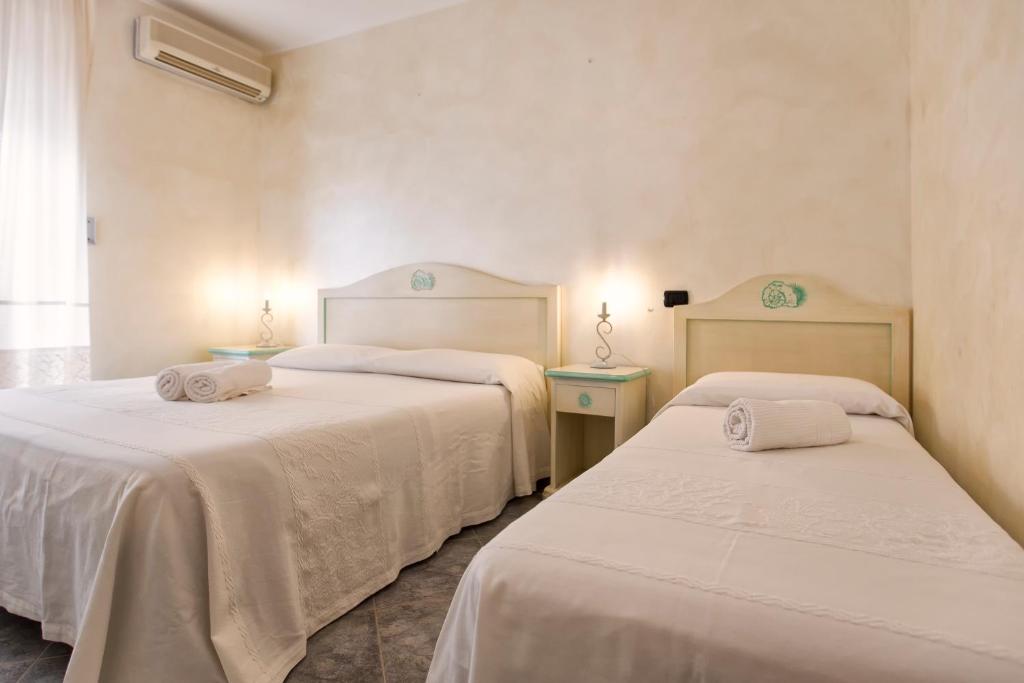 Postel nebo postele na pokoji v ubytování Morpheo Rooms