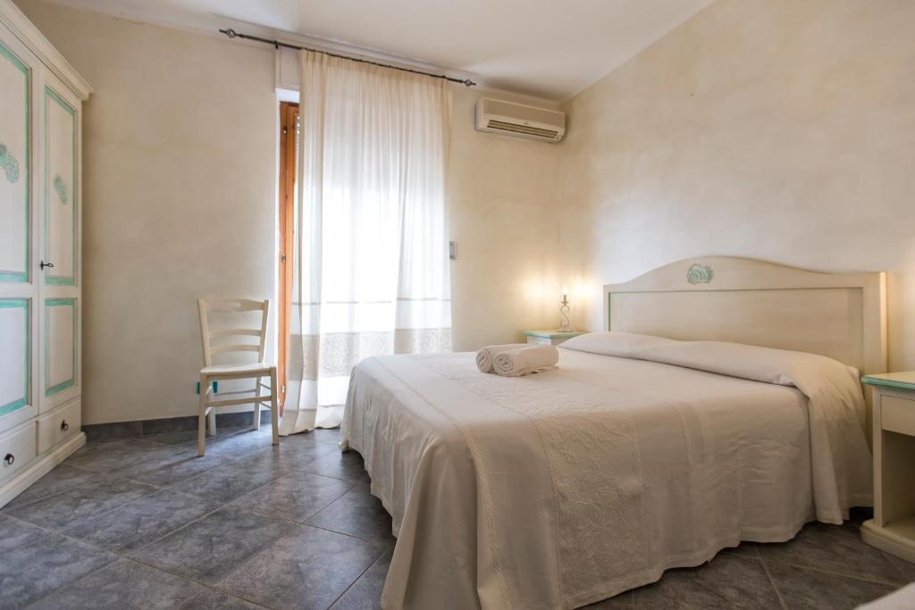 Postel nebo postele na pokoji v ubytování Morpheo Rooms