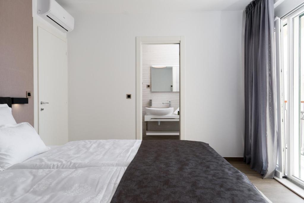 Postel nebo postele na pokoji v ubytování Hotel - Teranea City Hvar