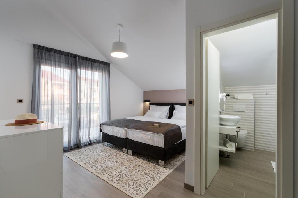 Postel nebo postele na pokoji v ubytování Hotel - Teranea City Hvar
