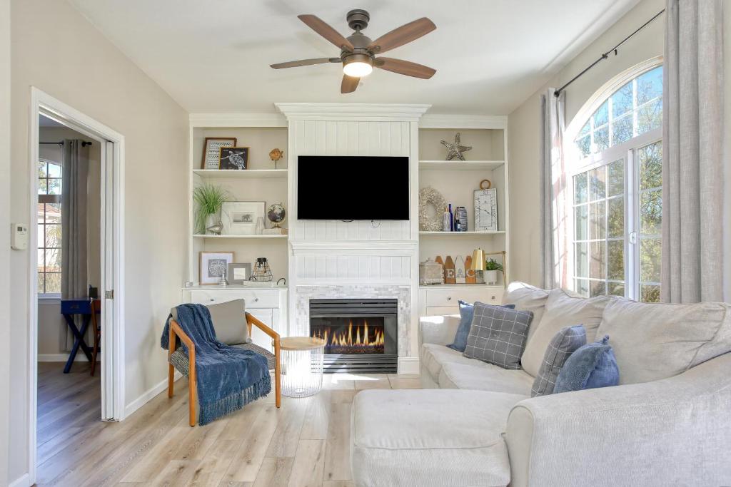 a living room with a white couch and a fireplace at Pacific Plaza #410 - Pacific Coast Hideaway - 1BdrmUp-K in Oceano