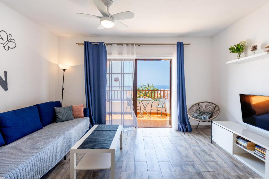 TV a/nebo společenská místnost v ubytování Las Bouganvillas Ocean View