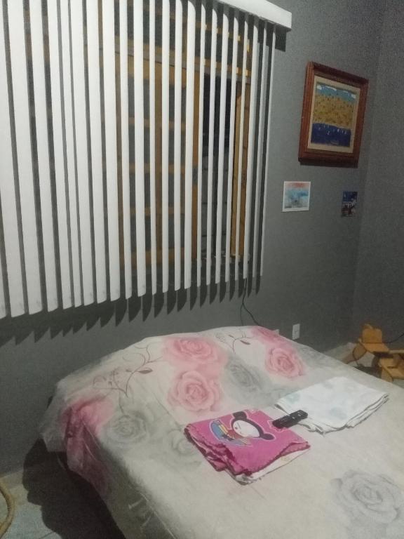 Postel nebo postele na pokoji v ubytování Quarto de Hóspedes da Menina Maricotinha