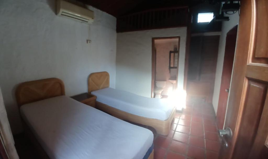 Postel nebo postele na pokoji v ubytování Posada Turistica Arimacoa